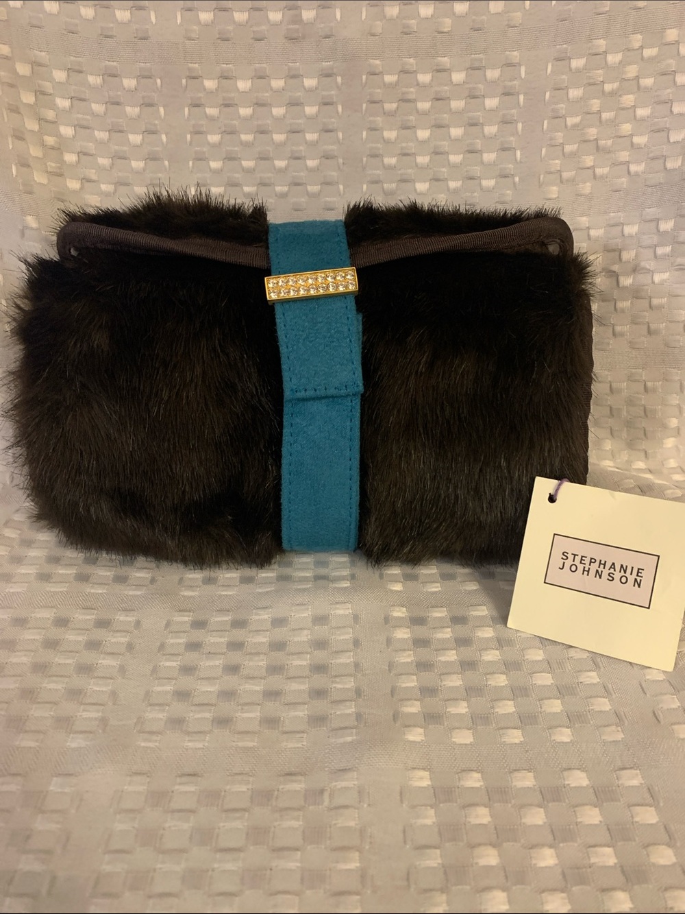 Stephanie Johnson Brown Faux Fur covered cosmetic bag, with a teal strap.